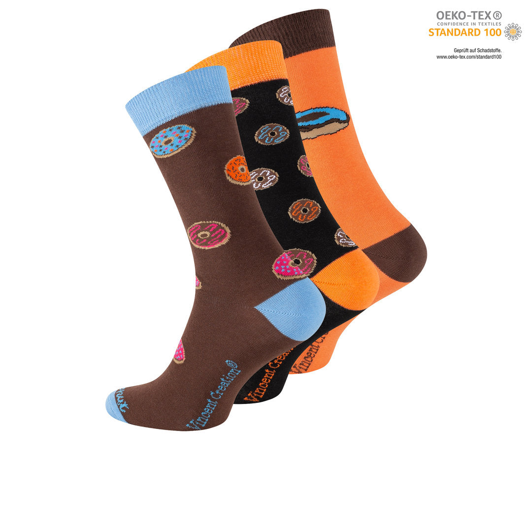 Mit unseren lustigen Donut-Socken wird jeder Schritt zum süßen Abenteuer. Die verspielten Designs und knalligen Farben machen diese Socken nicht nur zu einem fröhlichen Accessoire, sondern auch zu einem tollen Geschenk für Naschkatzen